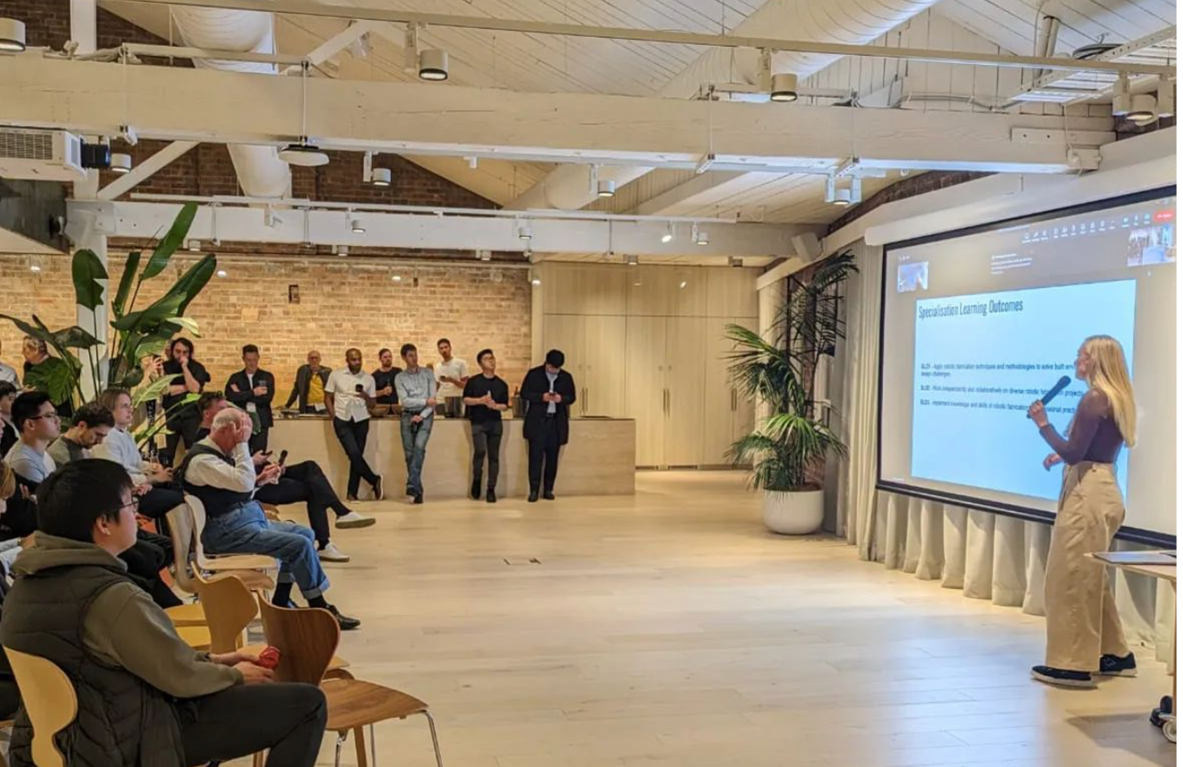 A Computational Design student presenting to an audience at a CoDe Conference